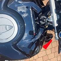 Top view of a Ducati Streetfighter V4S motorcycle with reflections.